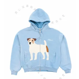 Light blue zip-up hoodie with a printed terrier on the front, laid flat on white