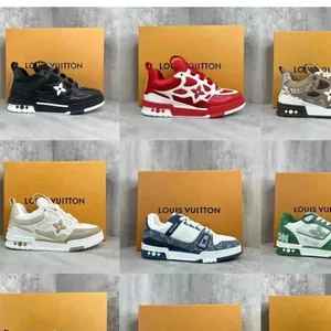 Nine pairs of low-top sneakers in different colorways, each standing on an orange shoe box