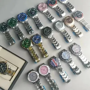 Rows of wristwatches with steel bracelets and colored dials spread across a table
